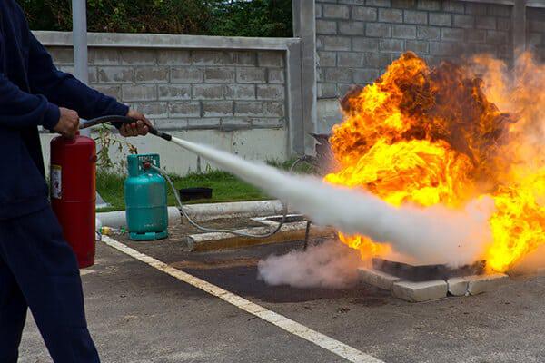 A Quality Fire Safety Management is teaching how to put out a fire with a fire extinguisher